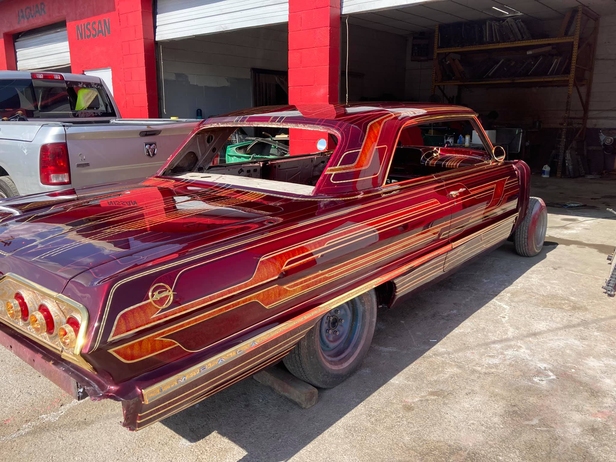 Impala restoration with candy paint and custom design patterns